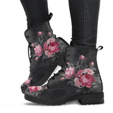 image shows gothic lace up combat boots with  black soles and black laces just above ankle length.  The boots feature a print of pink and grey roses on a grey grungy background